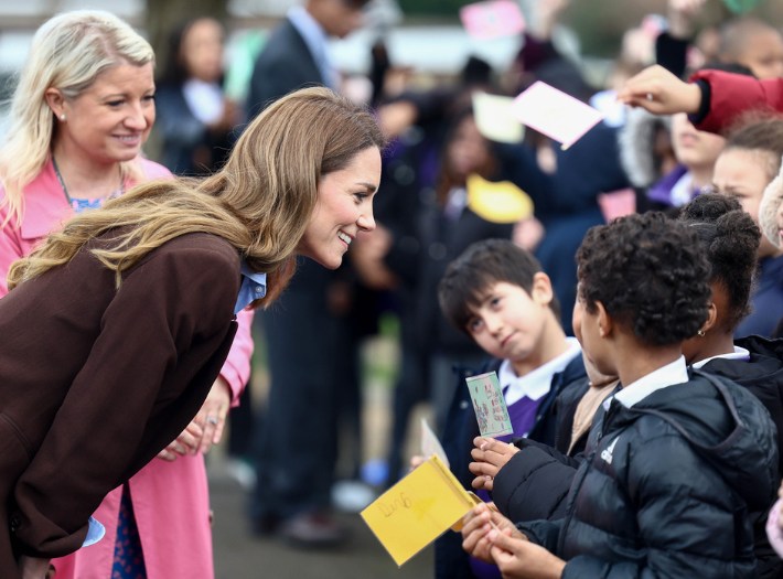 The Princess talking with pupils from Castle Hill Academy. They're standing outside the school.