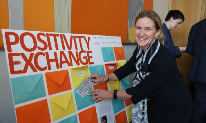Kim Leadbeater, MP for Spen Valley, putting a positive note into the positivity exchange activity ready for someone else to read