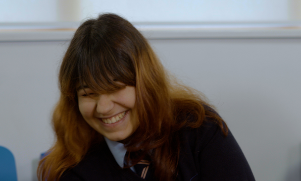 Secondary-aged pupil laughing