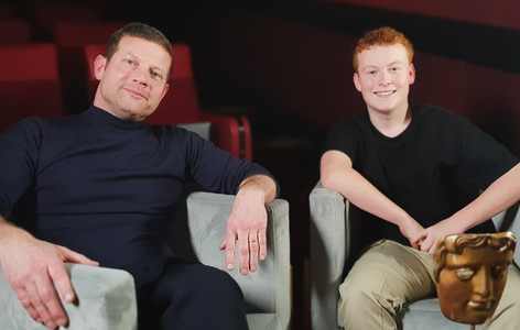 Presenter and broadcaster, Dermot O'Leary, sitting with BAFTA Young Presenter Braydon