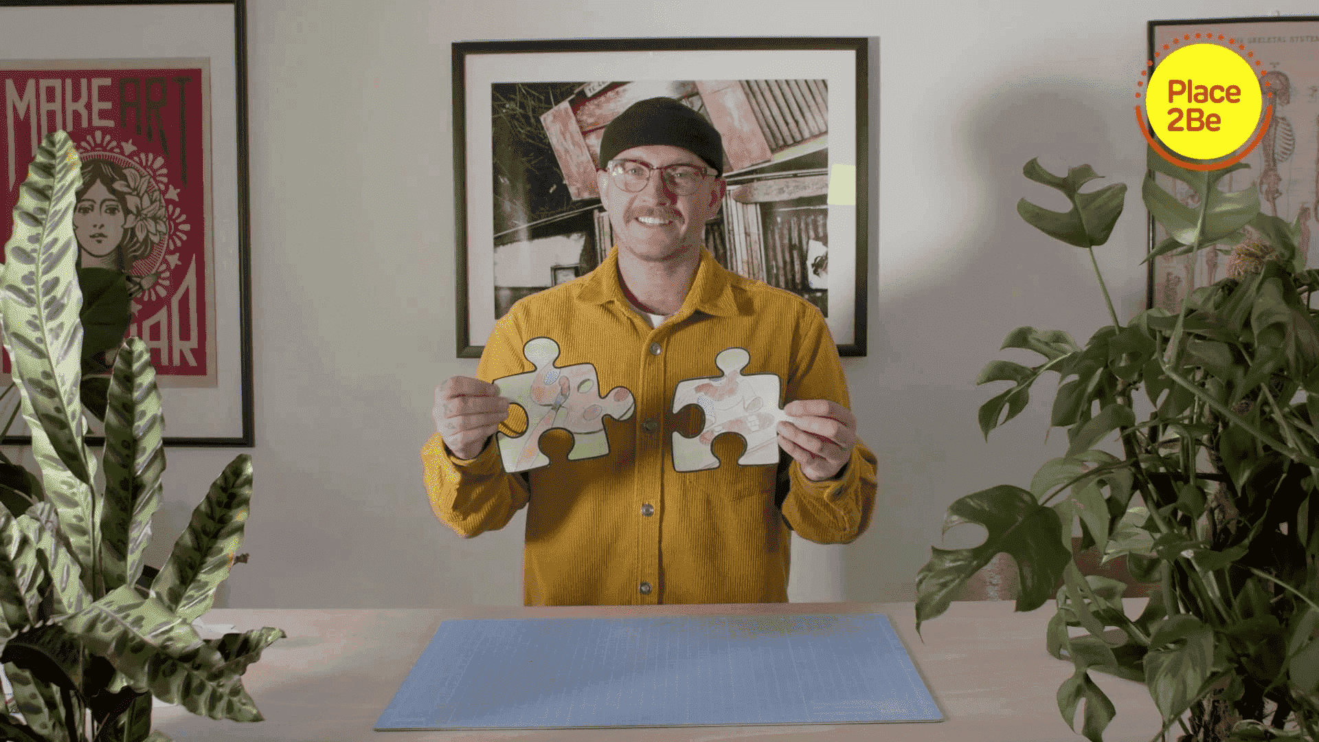 Ricky Martin, Place2Be Ambassador, holding up two puzzle pieces